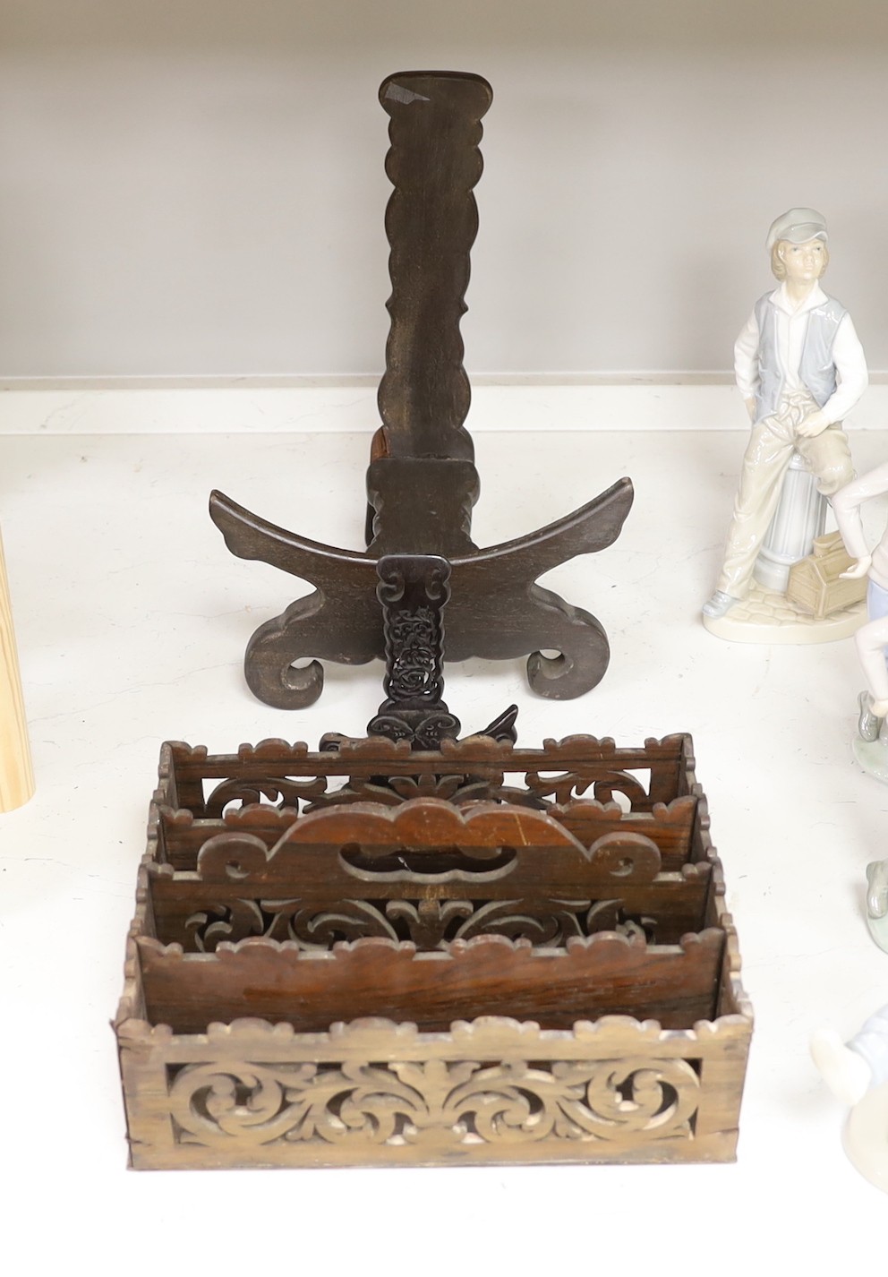 Two Chinese hardwood plate stands and a fret cut rosewood letter rack, 26cm wide